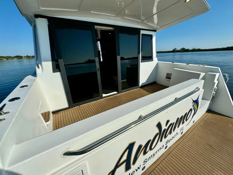 Slide: The Image of 1998 Navigator Pilothouse yacht deck with "Andiamo" signage, New Smyrna Beach, Florida. - 14