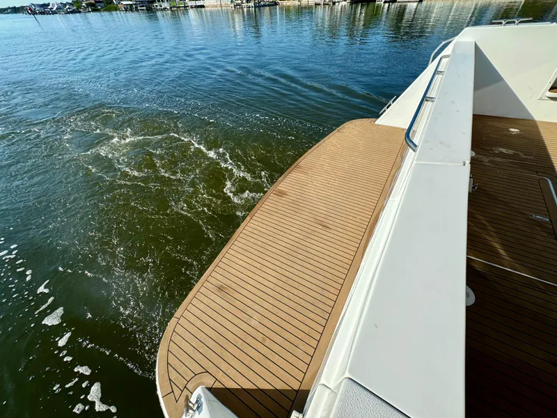 Slide: The Image of 1998 Navigator Pilothouse boat deck on calm water. - 15