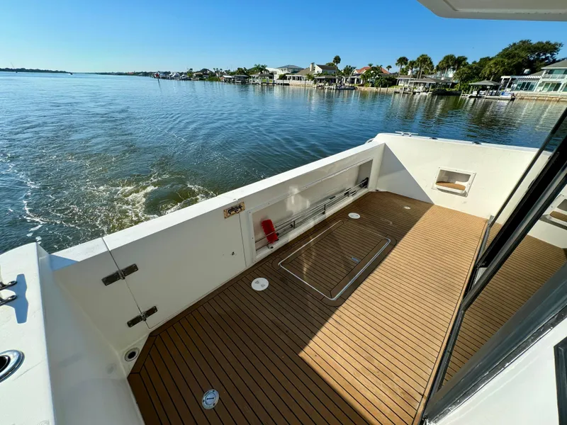 Slide: The Image of 1998 Navigator Pilothouse boat deck with scenic waterfront view. - 16