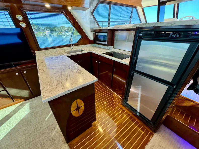 Slide: The Image of Luxurious 1998 Navigator Pilothouse kitchen with marble countertops and modern appliances. - 22