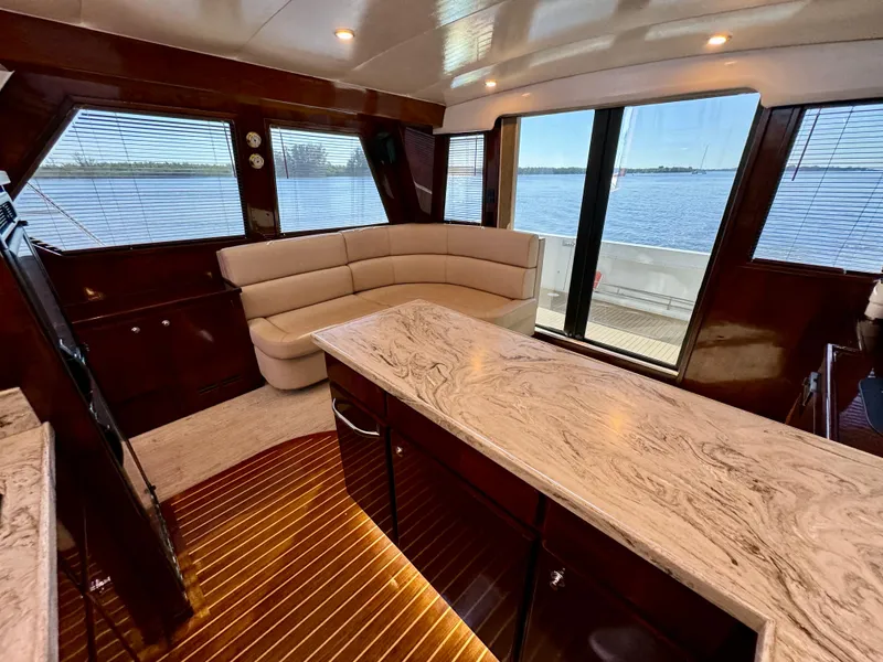 Slide: The Image of Luxurious 1998 Navigator Pilothouse interior with elegant seating and panoramic windows. - 24