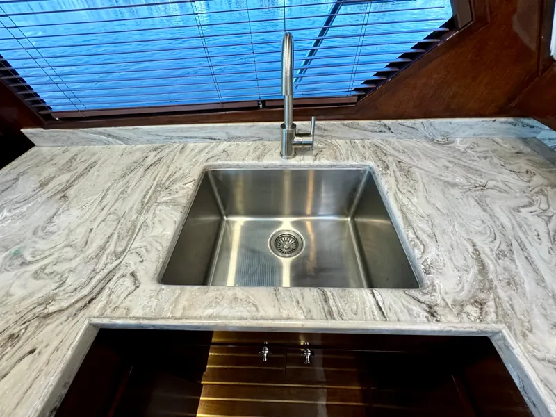 Slide: The Image of Stainless steel sink on marble countertop in 1998 Navigator Pilothouse yacht kitchen. - 26