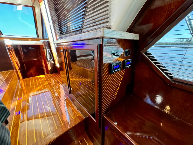 Slide: The Image of Luxurious 1998 Navigator Pilothouse interior with polished wood and modern controls. - 28