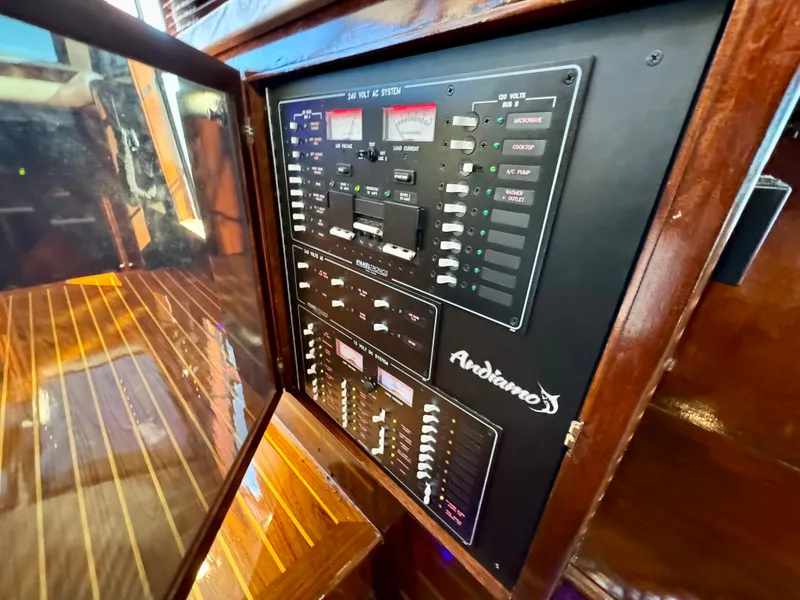 Slide: The Image of Electrical control panel inside 1998 Navigator Pilothouse yacht with wooden interior. - 30