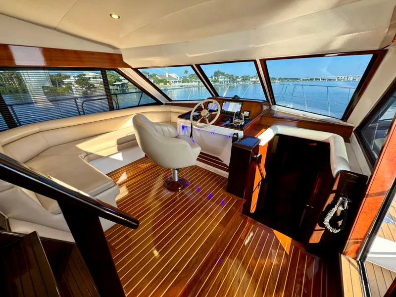 Slide: The Image of Luxurious 1998 Navigator Pilothouse interior with panoramic windows and elegant wood flooring. - 31
