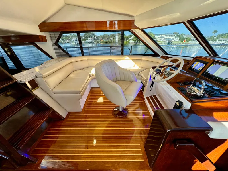Slide: The Image of Luxurious 1998 Navigator Pilothouse interior with leather seating and polished wood flooring. - 32