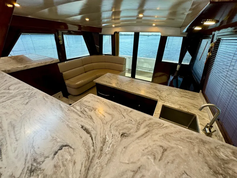 Slide: The Image of Luxurious 1998 Navigator Pilothouse interior with marble countertops and panoramic windows. - 34