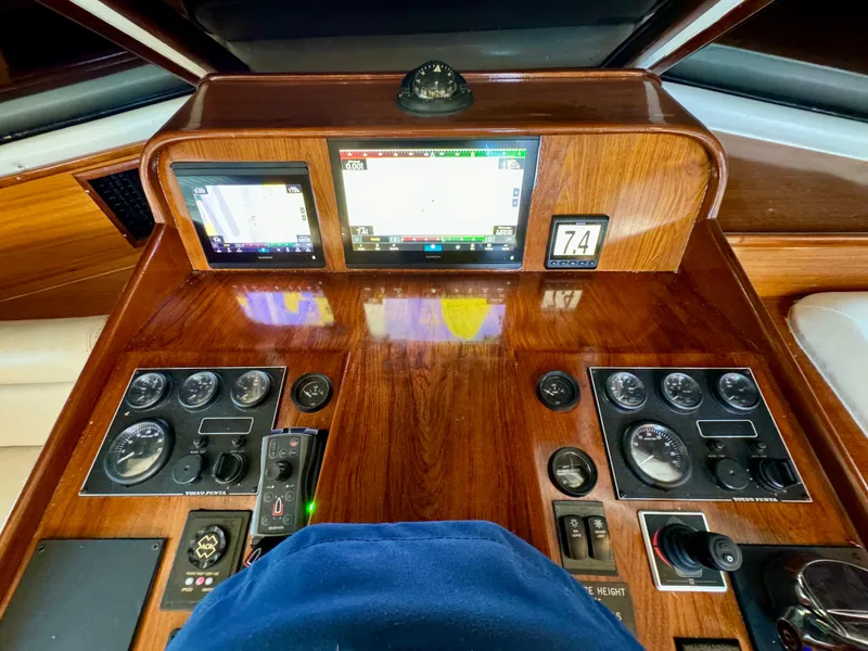 Slide: The Image of Navigator Pilothouse 1998 dashboard with navigation screens and control panels. - 35