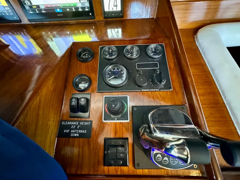 Slide: The Image of 1998 Navigator Pilothouse control panel with gauges and throttle lever. - 37