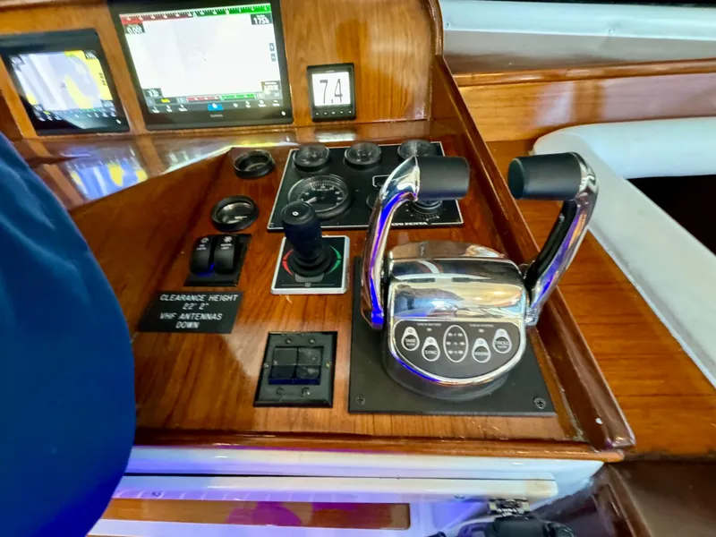 Slide: The Image of Navigator Pilothouse 1998 control panel with throttle levers and navigation instruments. - 38