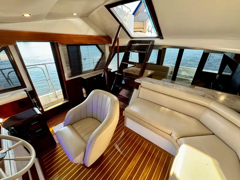 Slide: The Image of Luxurious 1998 Navigator Pilothouse interior with leather seating and wood flooring. - 39