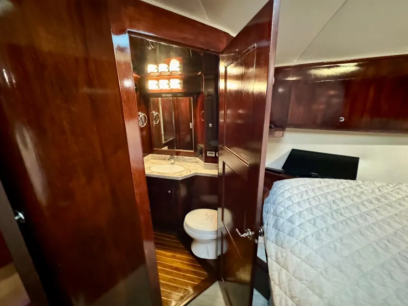 Slide: The Image of Luxurious 1998 Navigator Pilothouse yacht interior with wood finish and cozy bathroom. - 45