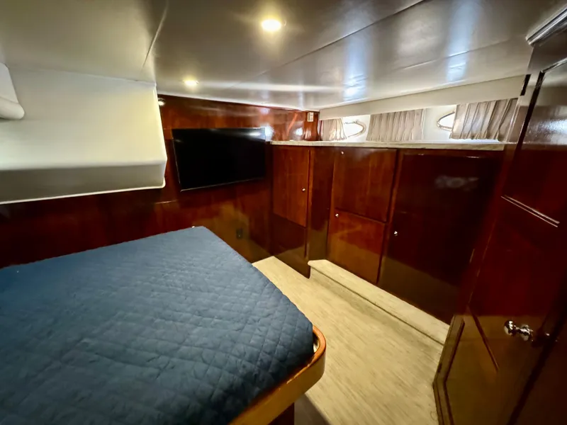 Slide: The Image of Luxurious 1998 Navigator Pilothouse cabin with wood paneling and modern amenities. - 49