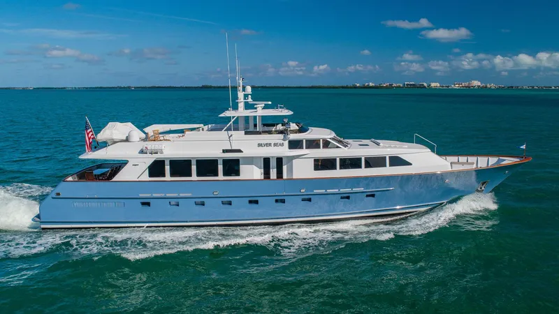 Slide: The Image of Luxurious 1998 Burger Raised Pilothouse yacht cruising on clear blue waters. - 1