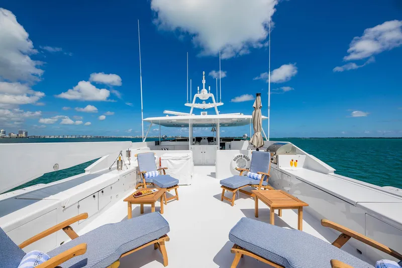 Slide: The Image of Luxurious 1998 Burger Raised Pilothouse yacht deck with lounge chairs and ocean view. - 16