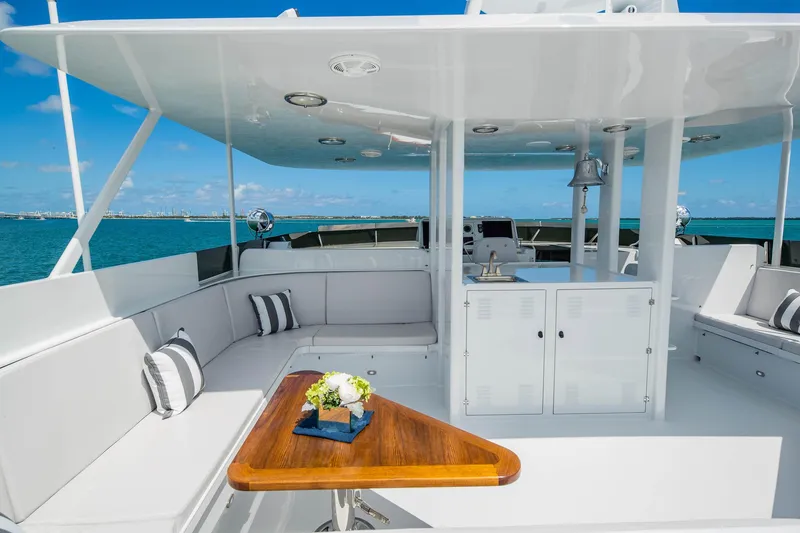 Slide: The Image of Luxurious 1998 Burger Raised Pilothouse yacht with elegant outdoor seating and ocean view. - 19