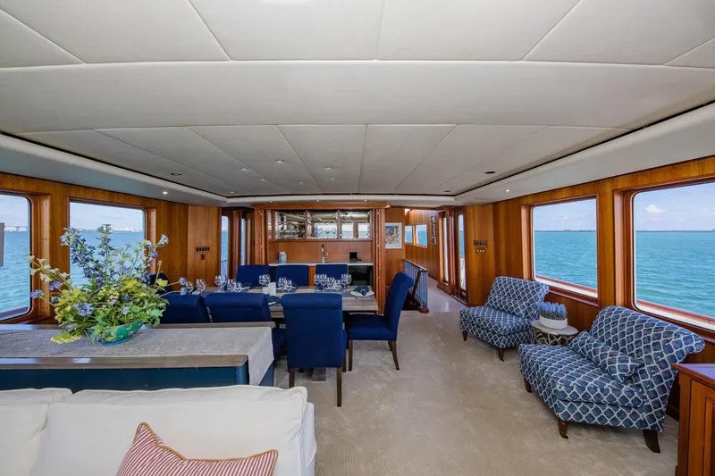 Slide: The Image of Luxurious 1998 Burger Raised Pilothouse yacht interior with elegant dining area and ocean views. - 27