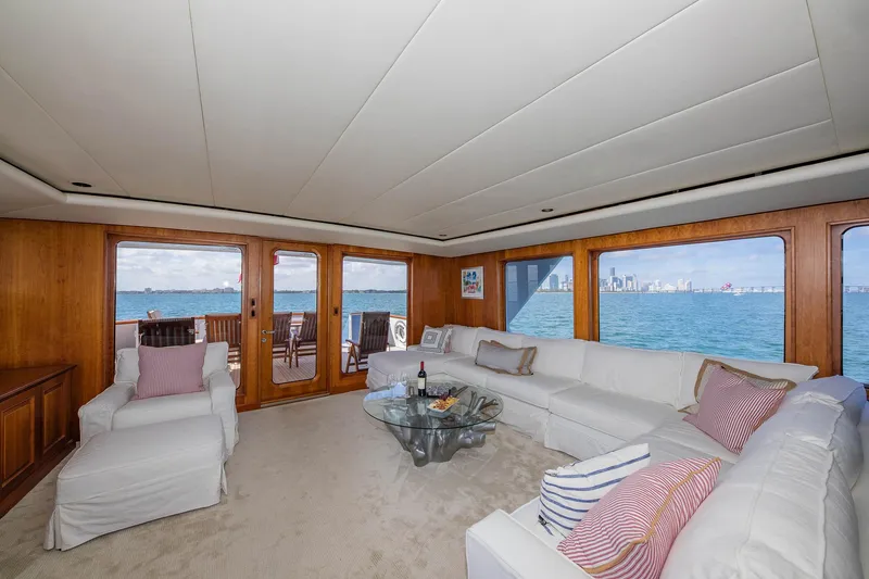 Slide: The Image of Luxurious 1998 Burger Raised Pilothouse yacht interior with ocean view and elegant seating. - 29