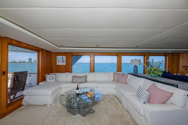 Slide: The Image of Luxurious 1998 Burger Raised Pilothouse yacht interior with ocean view and elegant seating area. - 30