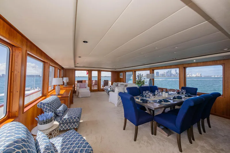 Slide: The Image of Luxurious 1998 Burger Raised Pilothouse yacht interior with elegant dining and seating area. - 31