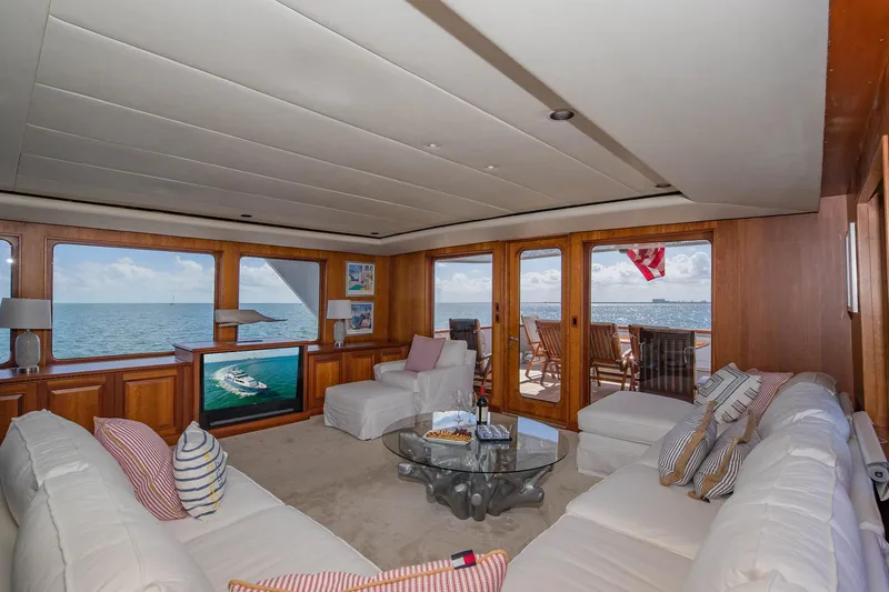 Slide: The Image of Luxurious 1998 Burger Raised Pilothouse yacht interior with ocean view and elegant seating area. - 32
