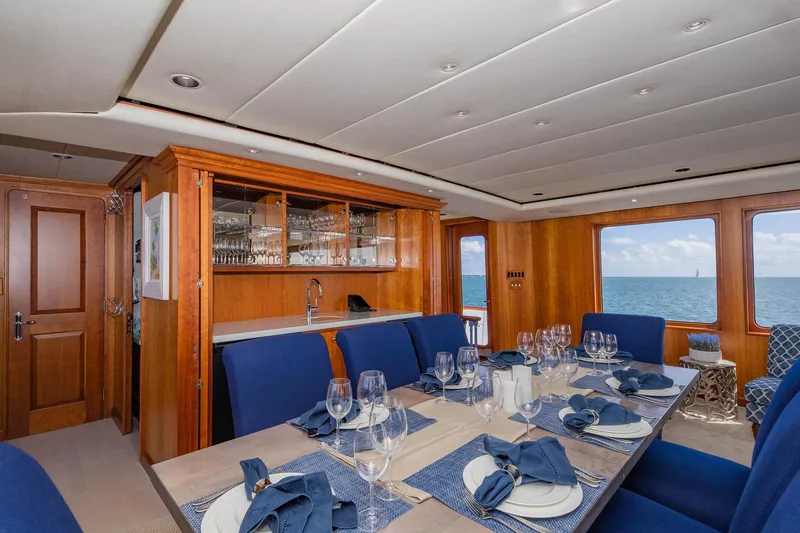 Slide: The Image of Luxurious dining area on 1998 Burger Raised Pilothouse yacht with ocean view. - 33