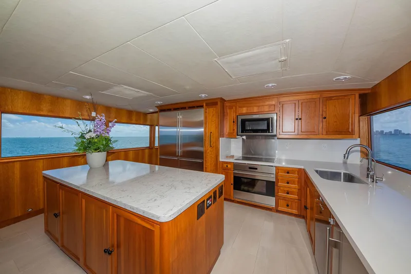 Slide: The Image of Luxurious 1998 Burger Raised Pilothouse yacht kitchen with ocean view and modern amenities. - 39