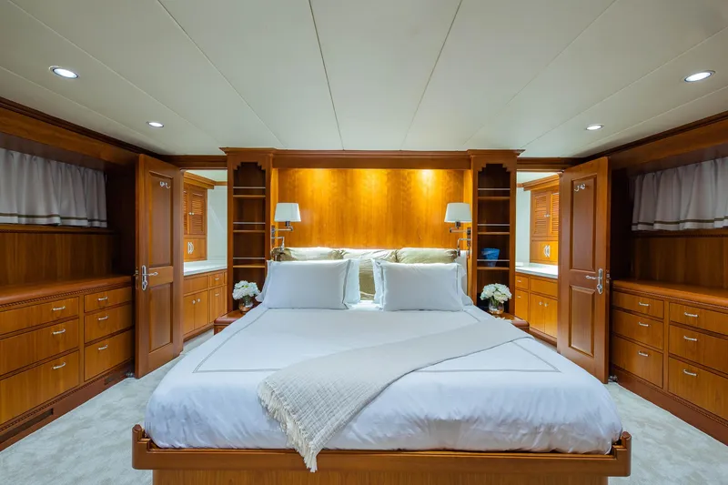 Slide: The Image of Luxurious bedroom in 1998 Burger Raised Pilothouse yacht with elegant wood paneling. - 43