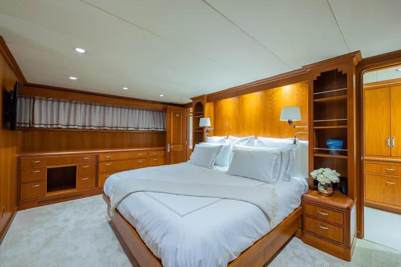 Slide: The Image of Luxurious bedroom in 1998 Burger Raised Pilothouse yacht with elegant wood paneling. - 44