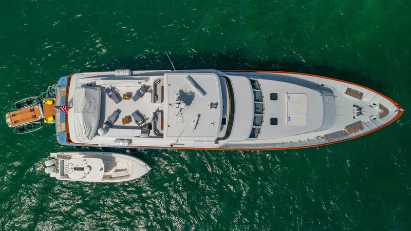 Slide: The Image of Aerial view of 1998 Burger Raised Pilothouse yacht on green water. - 6
