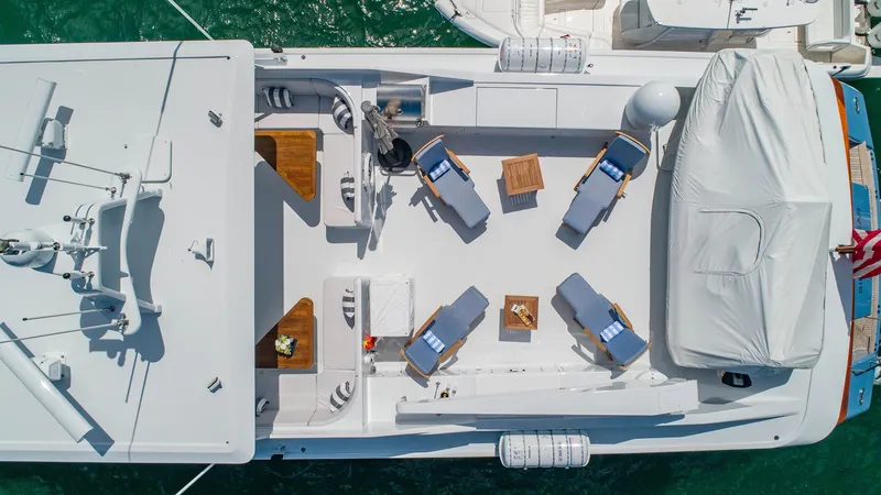 Slide: The Image of Aerial view of 1998 Burger Raised Pilothouse yacht deck with lounge chairs and tables. - 7