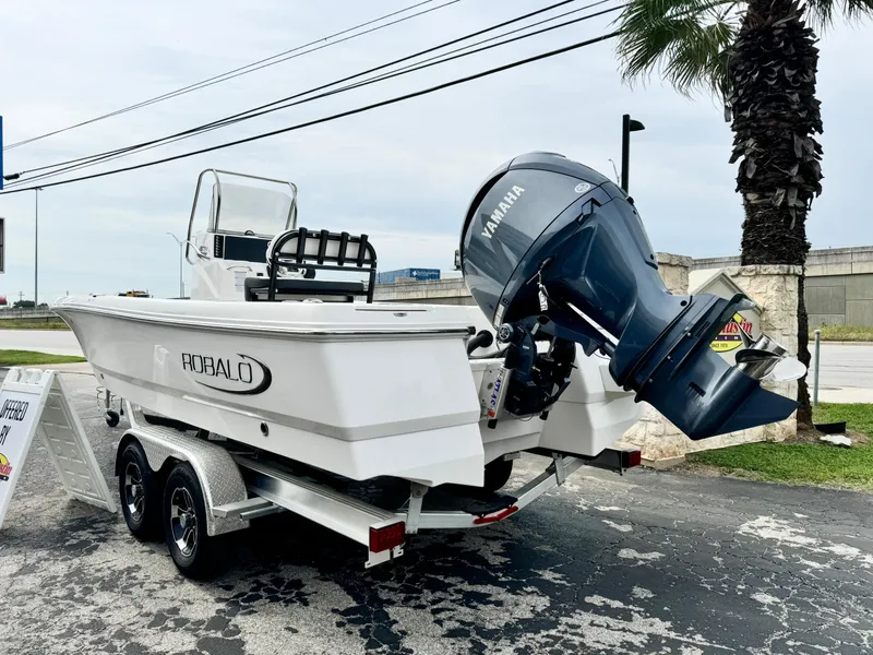 Slide: The Image of 2024 Robalo 226 Cayman boat on trailer with Yamaha outboard motor. - 23
