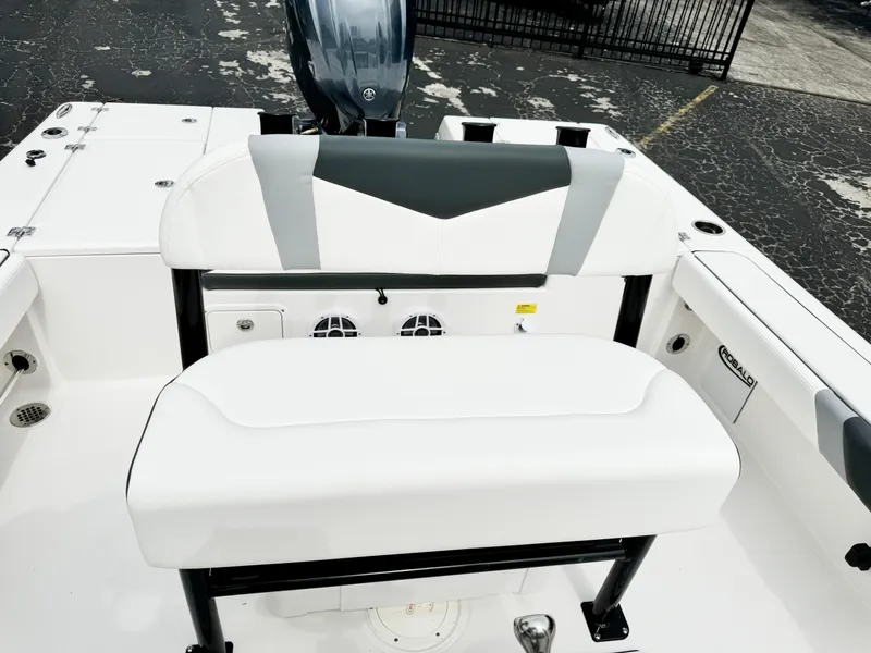 Slide: The Image of 2024 Robalo 226 Cayman boat interior with white seating and black accents. - 39