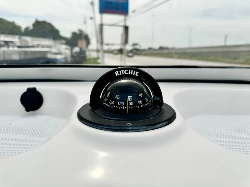 Slide: The Image of Ritchie compass on 2024 Robalo 226 Cayman boat dashboard. - 42
