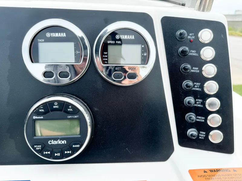 Slide: The Image of Dashboard of 2024 Robalo 226 Cayman with Yamaha gauges and Clarion audio system. - 43
