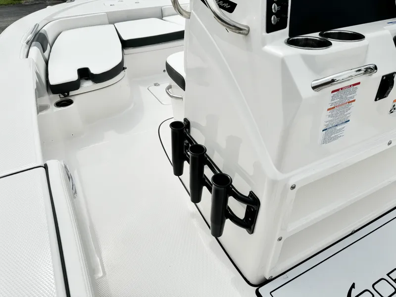 Slide: The Image of 2024 Robalo 226 Cayman boat interior with rod holders and seating. - 47