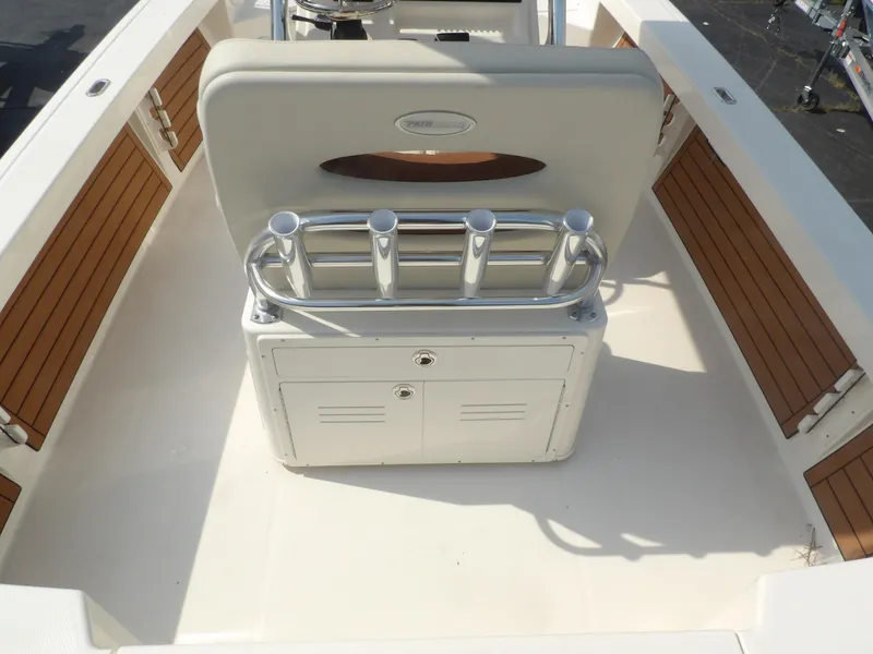 Slide: The Image of 2024 Pathfinder 2400 TRS boat interior with rod holders and storage. - 6