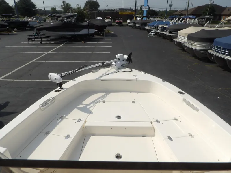 Slide: The Image of 2024 Pathfinder 2400 TRS boat in a marina, surrounded by other boats. - 9