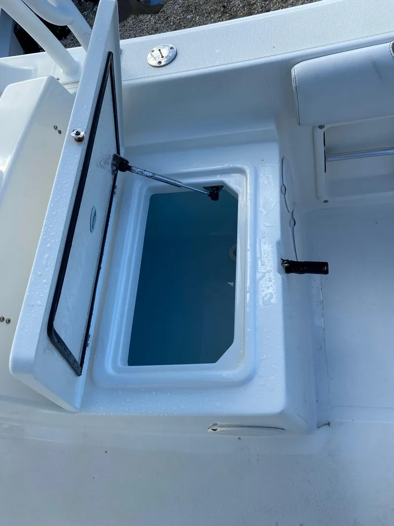 Slide: The Image of 2018 World Cat 255 DC boat with open storage compartment. - 14