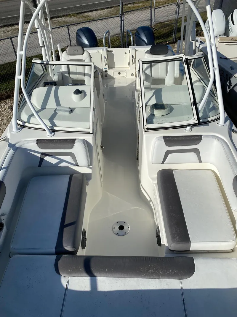Slide: The Image of 2018 World Cat 255 DC boat interior with dual consoles and seating. - 16