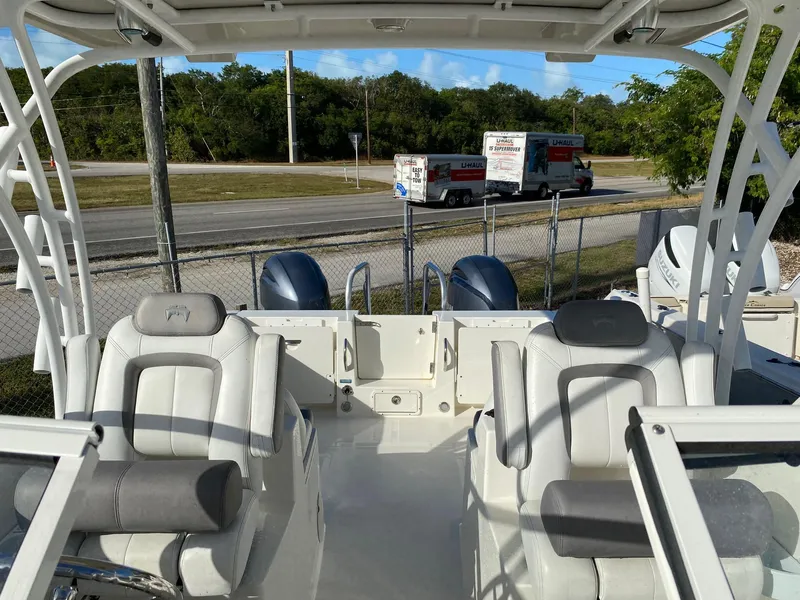 Slide: The Image of 2018 World Cat 255 DC boat interior with dual seating and twin engines. - 4