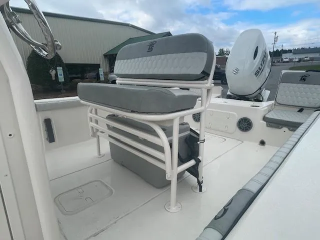 Slide: The Image of 2025 Carolina Skiff 23LS boat interior with seating and storage. - 9