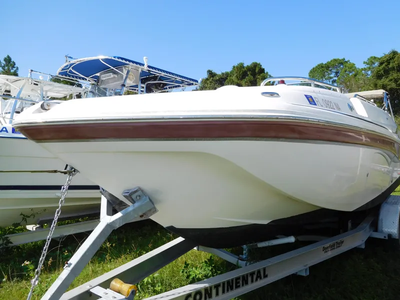 The Image of 2006 Hurricane SD 260 boat on trailer, side view, outdoors. - 1