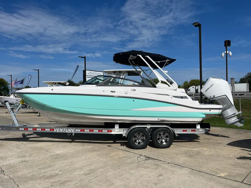 The Image of 2025 Monterey M-45 boat on trailer, turquoise hull, outdoor display. - 0