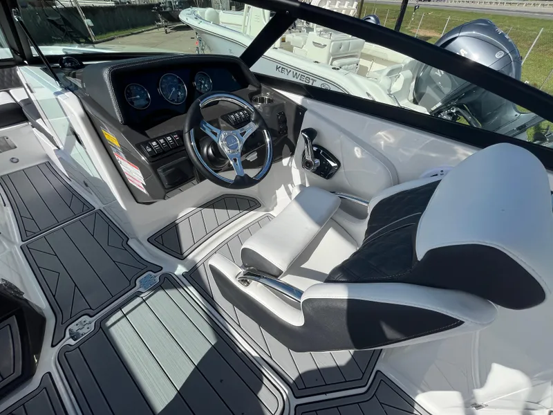 Slide: The Image of 2025 Monterey M-45 boat interior with modern dashboard and seating. - 15