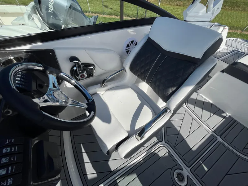 Slide: The Image of 2025 Monterey M-45 boat interior with sleek steering wheel and luxurious seating. - 16