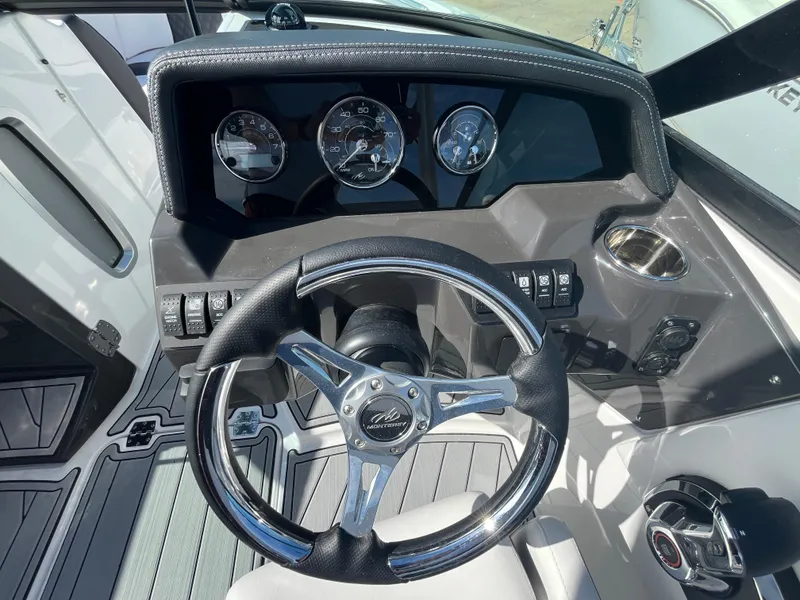 Slide: The Image of 2025 Monterey M-45 boat dashboard with steering wheel and instrument panel. - 17