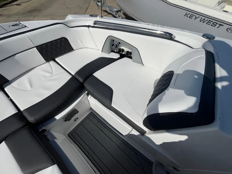 Slide: The Image of 2025 Monterey M-45 boat interior with sleek black and white seating. - 25