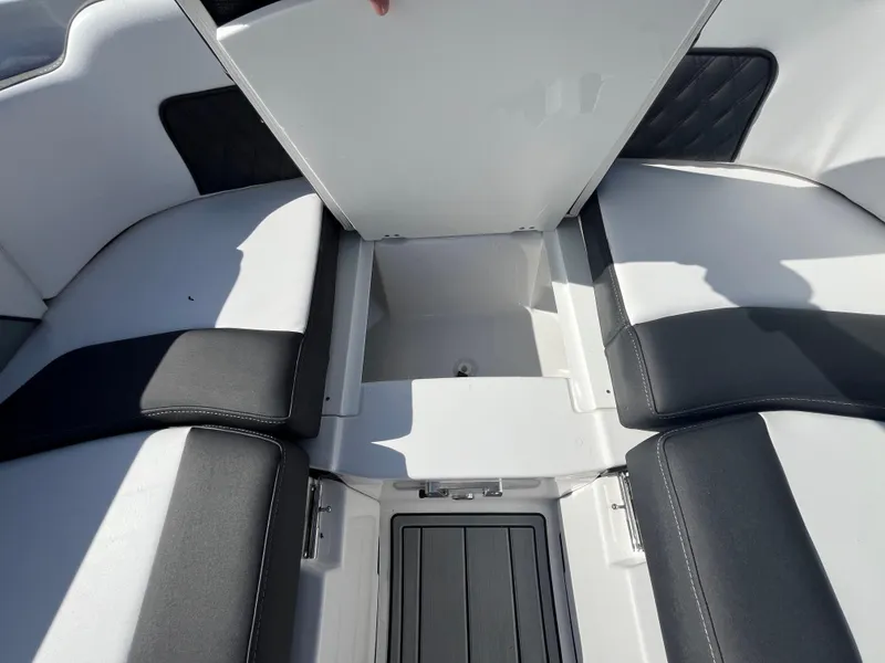 Slide: The Image of 2025 Monterey M-45 boat interior storage compartment with cushioned seating. - 26