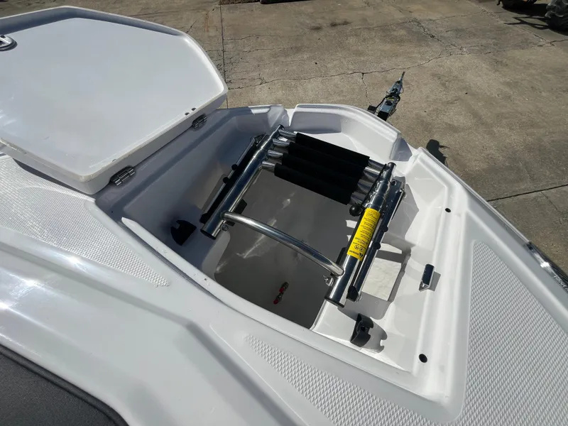 Slide: The Image of Open storage compartment on 2025 Monterey M-45 boat, featuring a built-in ladder. - 28